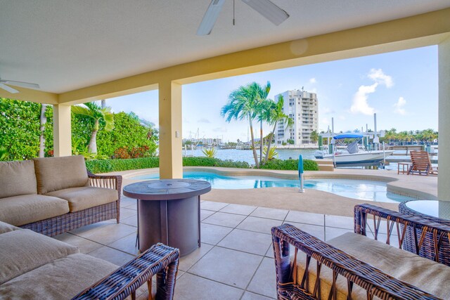160 1st St, Key Colony, FL 33051 - view of patio / terrace featuring a ceiling fan, an outdoor pool, an outdoor living space, and a water view