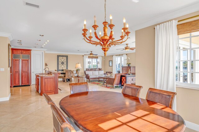 160 1st St, Key Colony, FL 33051 - dining room with a ceiling fan, baseboards, ornamental molding, a chandelier, and light tile patterned flooring