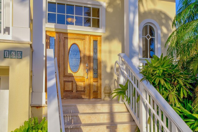 160 1st St, Key Colony, FL 33051 - property entrance featuring stucco siding