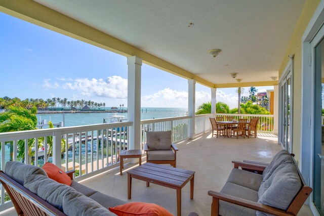 160 1st St, Key Colony, FL 33051 - balcony featuring an outdoor hangout area, a water view, and outdoor dining area