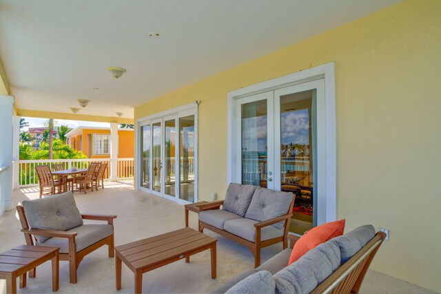 160 1st St, Key Colony, FL 33051 - view of patio / terrace with an outdoor living space, french doors, and outdoor dining area