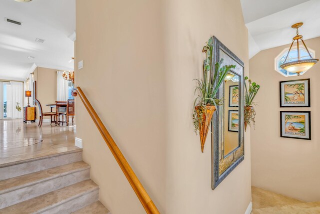 160 1st St, Key Colony, FL 33051 - stairway featuring healthy amount of natural light and a chandelier