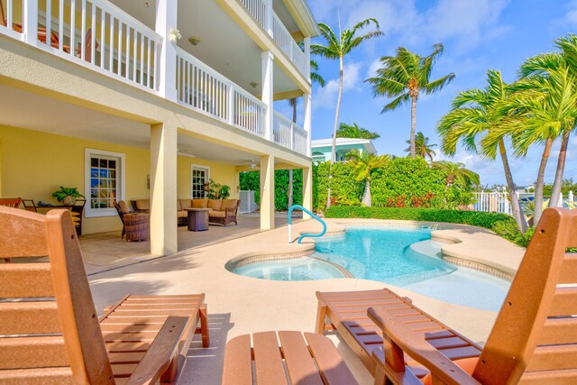 160 1st St, Key Colony, FL 33051 - view of swimming pool with an outdoor living space, a patio area, and a pool with connected hot tub