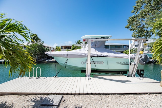 view of dock featuring a water view and boat lift