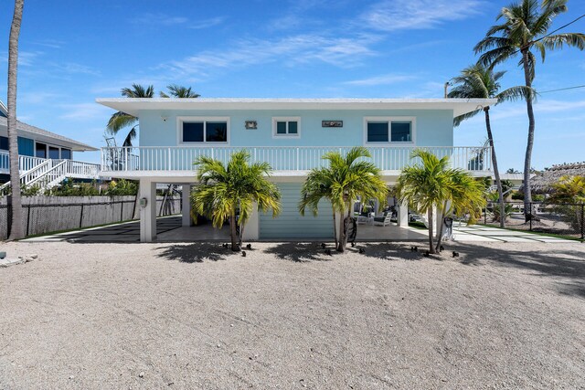 125 Cortez Dr, Islamorada, FL 33036 - coastal home with a carport and fence