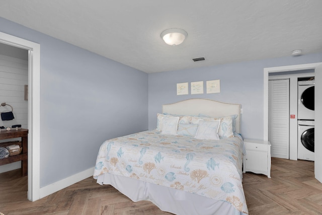 62 Sombrero Beach Rd, Marathon, FL 33050 - bedroom with estacked washer and dryer and baseboards