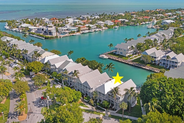 bird's eye view featuring a residential view and a water view