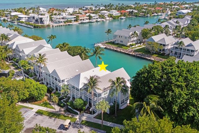 birds eye view of property featuring a residential view and a water view