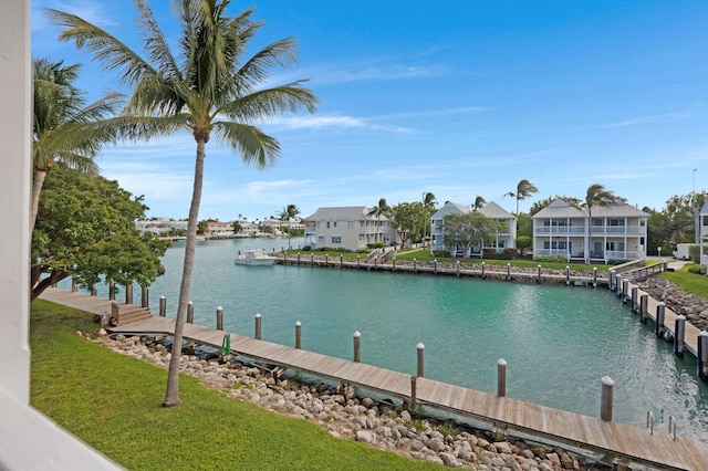 property view of water featuring a residential view and a boat dock