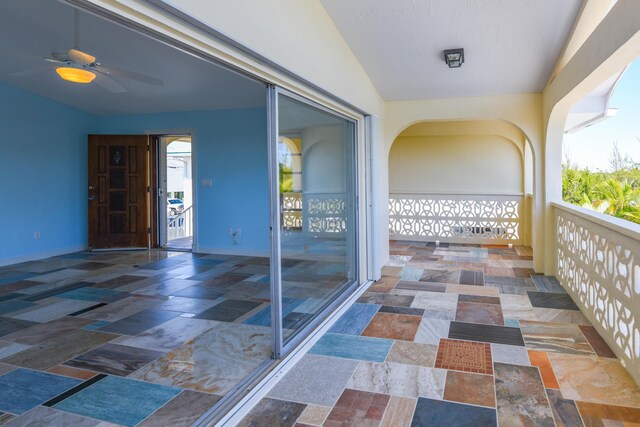 balcony featuring a ceiling fan