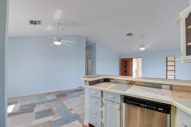 kitchen featuring lofted ceiling, light countertops, visible vents, and stainless steel dishwasher