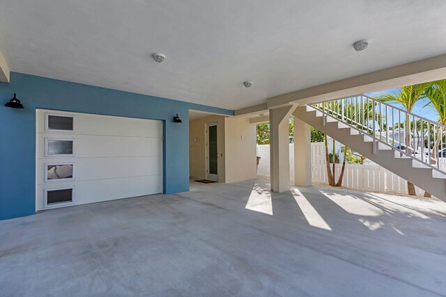 view of patio / terrace featuring stairs and fence