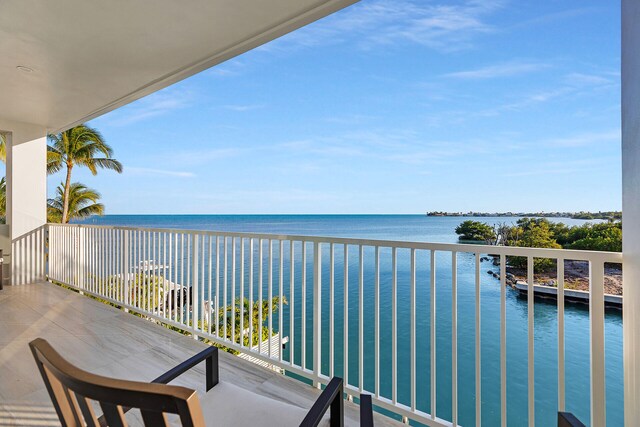 balcony featuring a water view