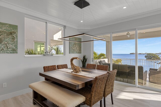 sunroom with a water view