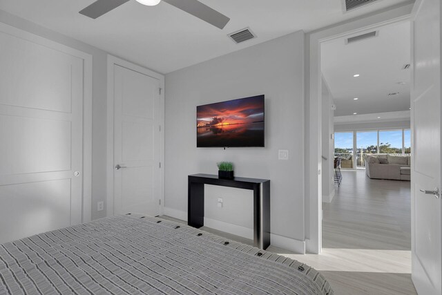 unfurnished bedroom with a ceiling fan, recessed lighting, visible vents, and wood finished floors