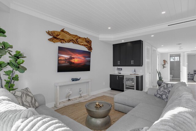 living area featuring baseboards, wooden ceiling, wine cooler, indoor wet bar, and recessed lighting