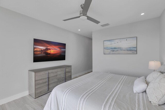 bedroom with recessed lighting, visible vents, light wood-style flooring, a ceiling fan, and baseboards