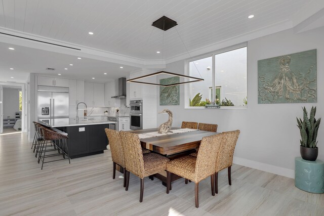 dining area with baseboards and recessed lighting