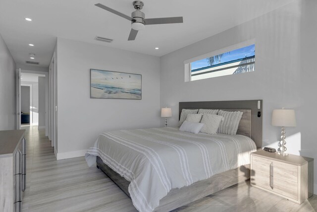 bedroom featuring recessed lighting, a ceiling fan, visible vents, baseboards, and light wood finished floors