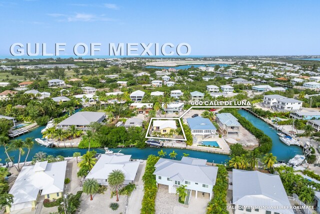 birds eye view of property with a residential view and a water view