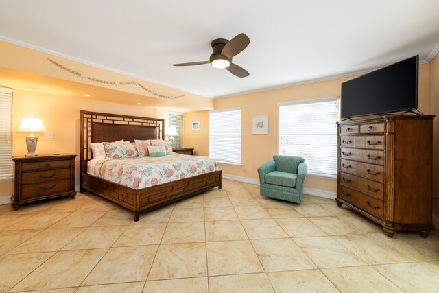 bedroom featuring ceiling fan, baseboards, crown molding, and light tile patterned flooring