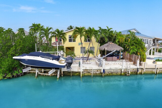 view of dock with a water view and boat lift