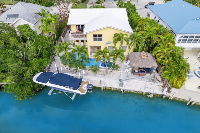 birds eye view of property featuring a water view