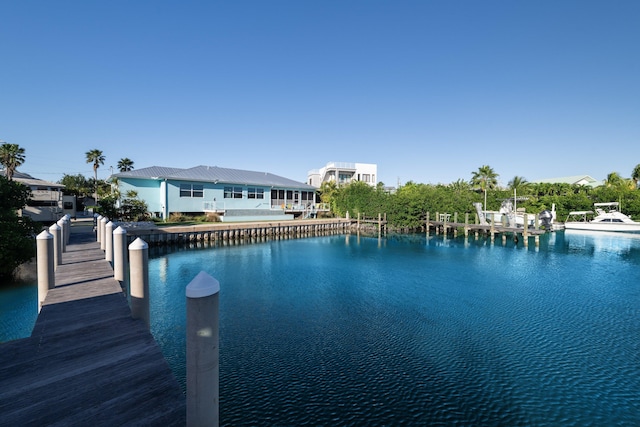 exterior space with a boat dock and a water view