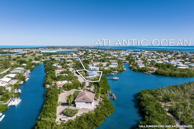 aerial view featuring a water view and a residential view