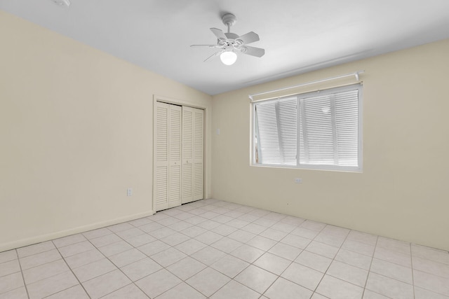 unfurnished bedroom featuring a closet and a ceiling fan