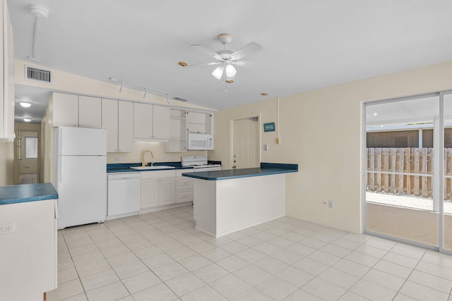 kitchen with white appliances, visible vents, a peninsula, open shelves, and a sink