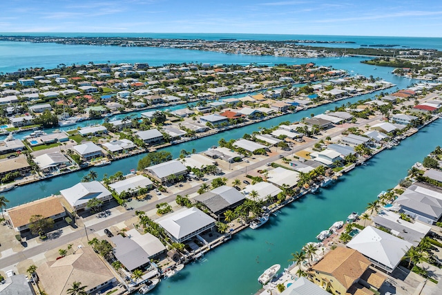 drone / aerial view with a water view and a residential view