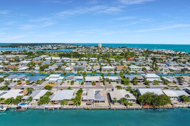 bird's eye view featuring a residential view and a water view