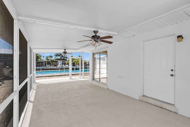 view of patio / terrace featuring a fenced in pool and a ceiling fan