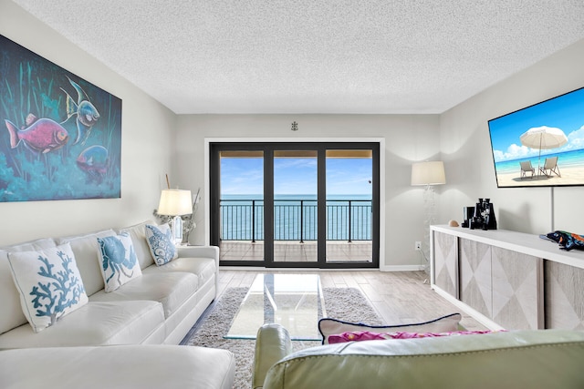 1001 Ocean Dr Unit 1-305, Key Colony, FL 33051 - living room with wood finished floors and a textured ceiling