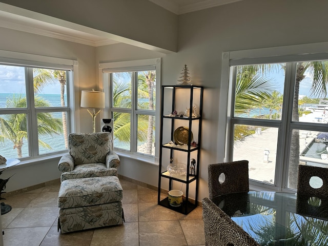 sitting room featuring baseboards and ornamental molding