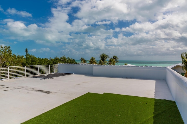 view of patio featuring a water view