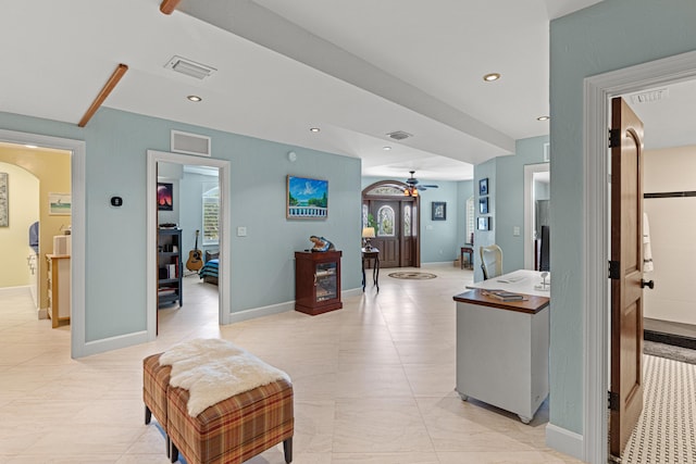 hallway with baseboards, visible vents, and recessed lighting