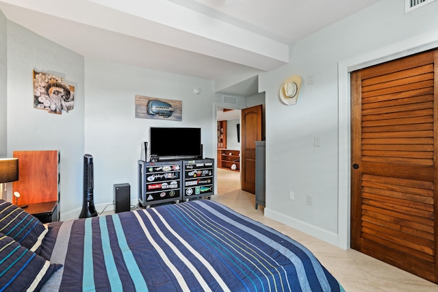 bedroom featuring visible vents and baseboards