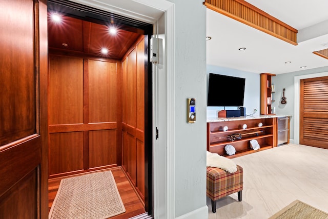 interior details featuring recessed lighting and elevator