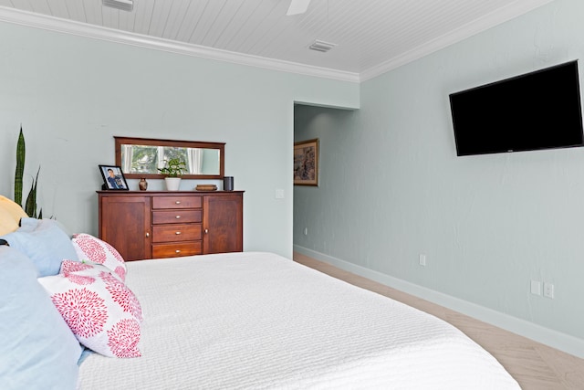 bedroom with a ceiling fan, baseboards, visible vents, and crown molding