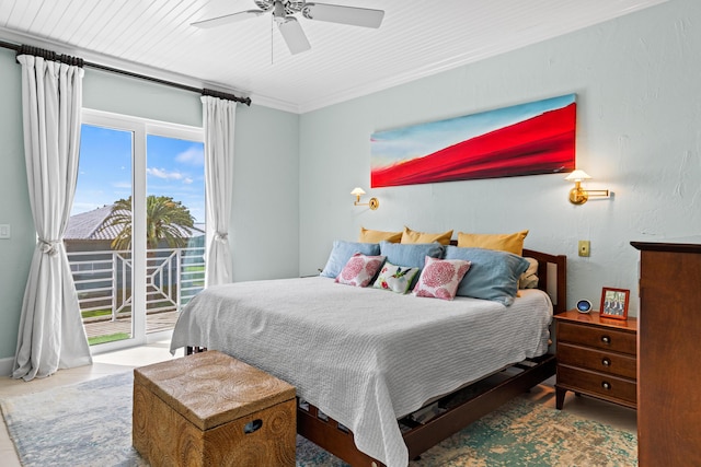 bedroom with access to outside, ceiling fan, and a textured wall