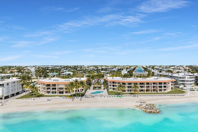drone / aerial view featuring a view of the beach and a water view