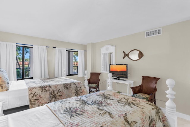 bedroom with visible vents and baseboards