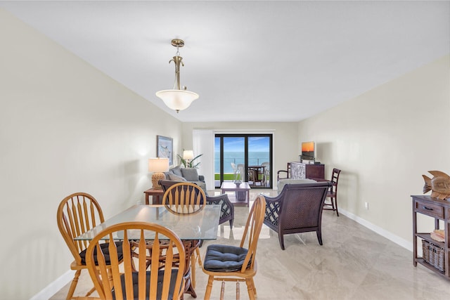 dining room featuring baseboards