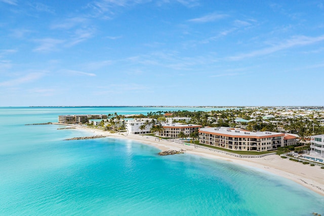 drone / aerial view featuring a view of the beach and a water view