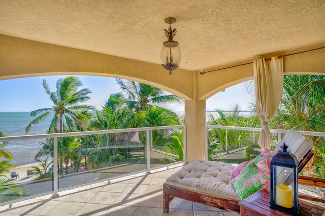 balcony featuring a water view