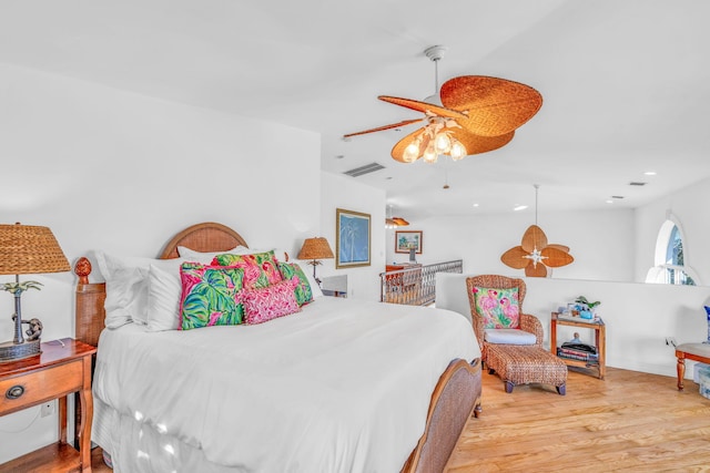 bedroom featuring ceiling fan, wood finished floors, visible vents, and recessed lighting