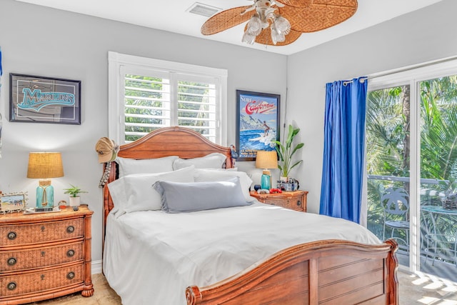 bedroom featuring access to outside, visible vents, and a ceiling fan