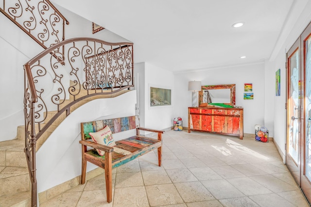 living area with stairs, baseboards, and recessed lighting